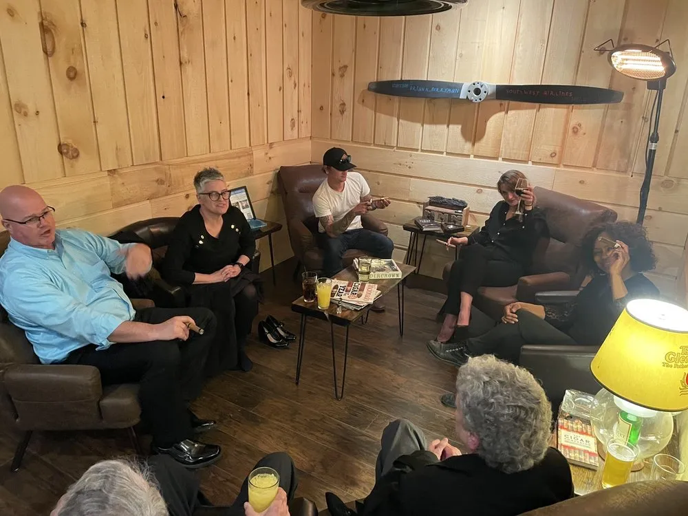 The Dusk — leather seating and a quiet corner for cigars and bourbon